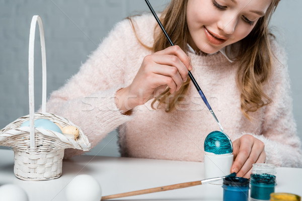 cropped shot of cute smiling girl painting easter egg  Stock photo © LightFieldStudios