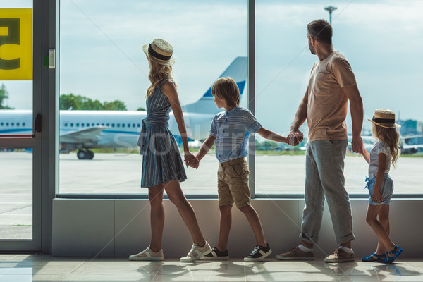 family looking out window in airport Stock photo © LightFieldStudios