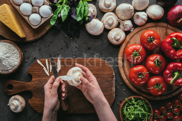 cropped shot of woman preparing ingredients for pizza on concrete table Stock photo © LightFieldStudios