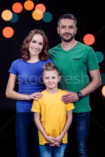Happy family standing together Stock photo © LightFieldStudios