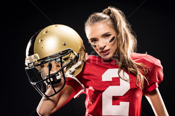 Female football player posing with helmet Stock photo © LightFieldStudios