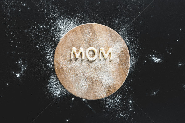Top view of edible lettering mom made from cookies on wooden cutting board, baking cookies concept Stock photo © LightFieldStudios