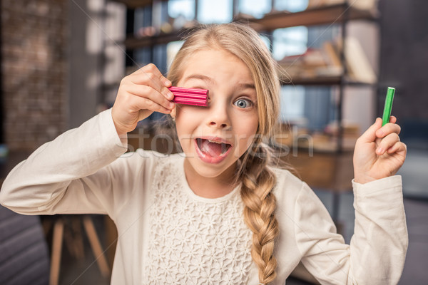 Girl playing with plasticine Stock photo © LightFieldStudios