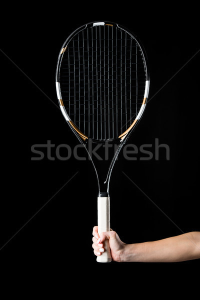 Hand with tennis racquet Stock photo © LightFieldStudios