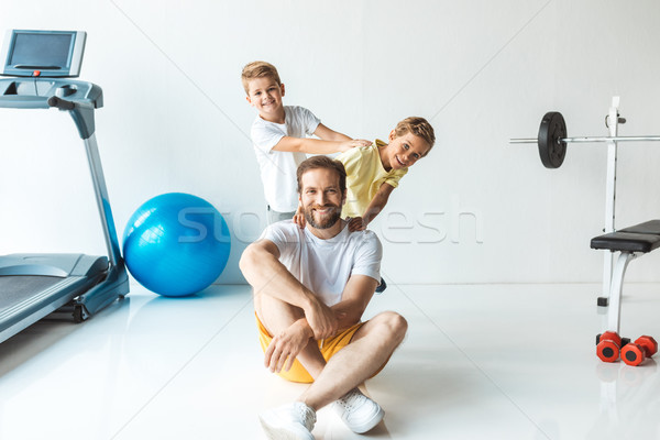 father with sons exercising together Stock photo © LightFieldStudios