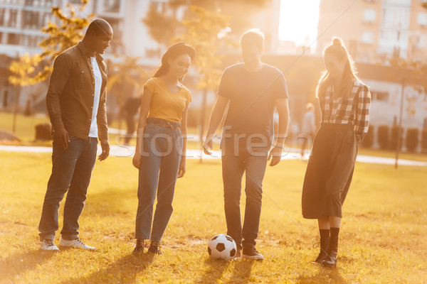 Stok fotoğraf: Arkadaşlar · oynama · futbol · genç · birlikte