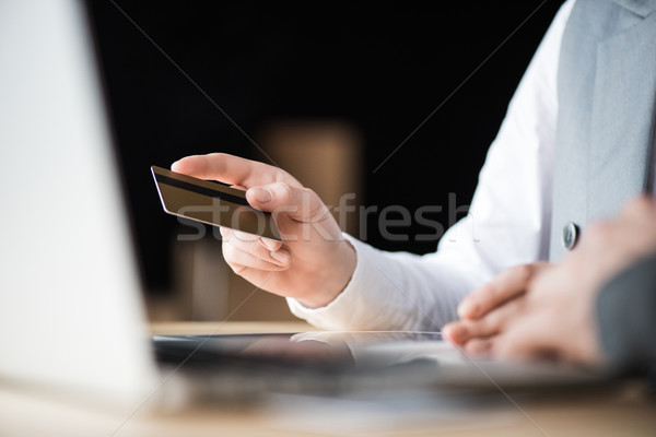 woman holding credit card Stock photo © LightFieldStudios
