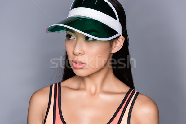 Asian woman in visor Stock photo © LightFieldStudios