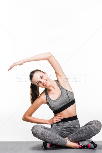 girl exercising on yoga mat Stock photo © LightFieldStudios