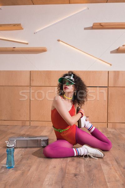 Stock photo: beautiful woman stretching on floor