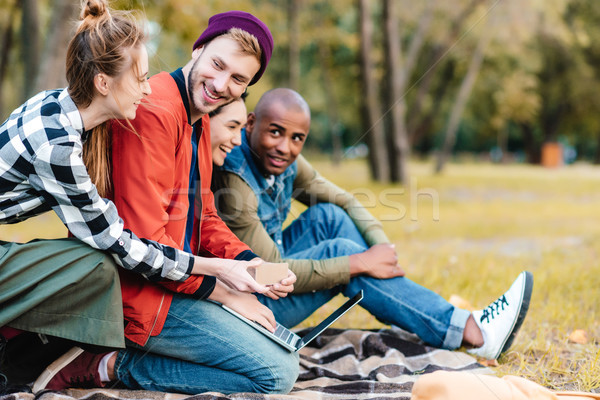 multicultural friends with laptop Stock photo © LightFieldStudios
