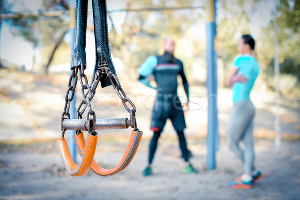 Couple working out with sport equipment on foreground Stock photo © LightFieldStudios