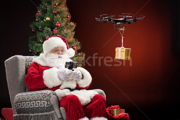 Stock photo: Santa Claus using drone