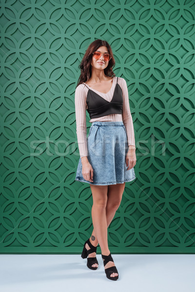 Vrouw jeans rok oranje zonnebril stijlvol Stockfoto © LightFieldStudios