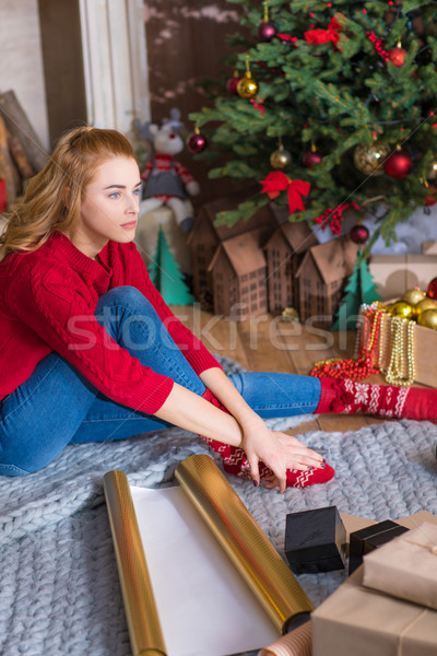Girl wrapping gift boxes Stock photo © LightFieldStudios
