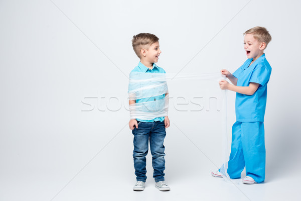 Kids playing doctor and patient Stock photo © LightFieldStudios