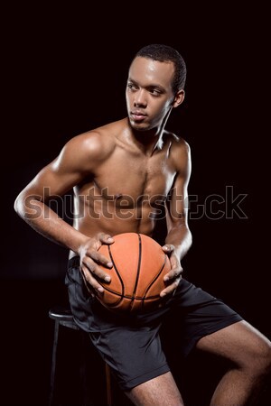 African american basketball player posing with ball on black  Stock photo © LightFieldStudios