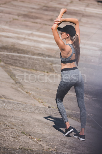 Nő sportruha sapka hátsó nézet áll fitnessz Stock fotó © LightFieldStudios