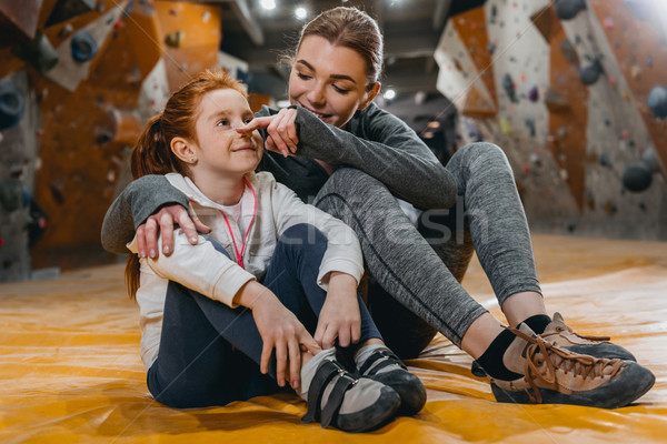 Girl and mom hugging on mat at gym  Stock photo © LightFieldStudios