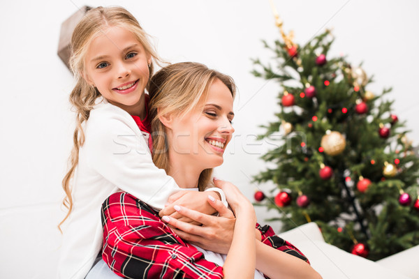 mother and daughter hugging Stock photo © LightFieldStudios