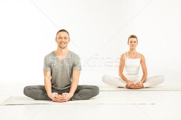 Couple sitting in lotus position  Stock photo © LightFieldStudios