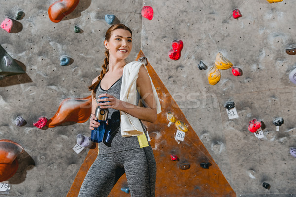 Sportive woman in front of climbing wall Stock photo © LightFieldStudios