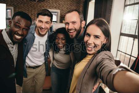 multiethnic friends taking selfie  Stock photo © LightFieldStudios