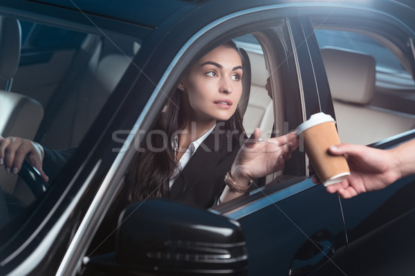 Woman getting coffee in drive-through Stock photo © LightFieldStudios