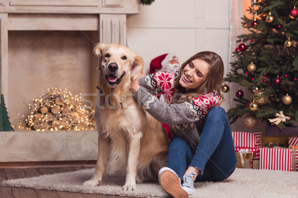young woman and dog at christmastime Stock photo © LightFieldStudios