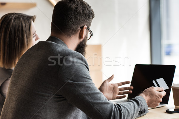 businesspeople with credit card looking at laptop Stock photo © LightFieldStudios