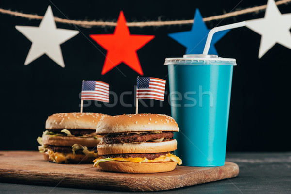 close up view of burgers with american flag and soda drink, presidents day celebration concept Stock photo © LightFieldStudios