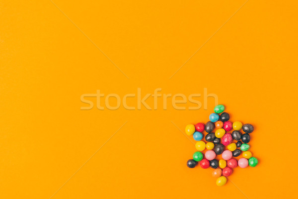 top view of star made of sweets isolated on orange, purim holiday concept Stock photo © LightFieldStudios