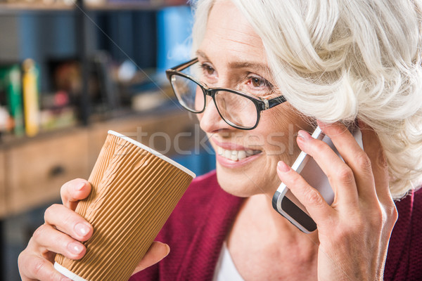 Woman talking on smartphone   Stock photo © LightFieldStudios