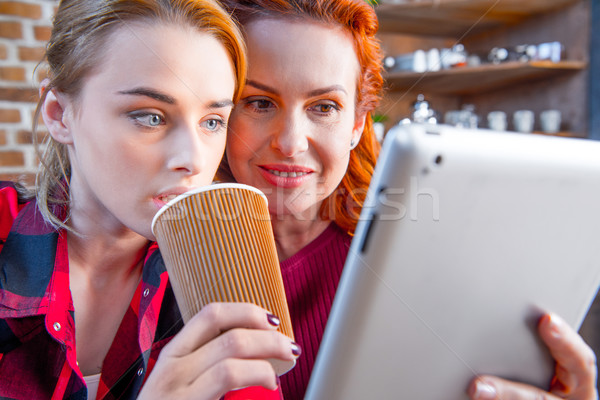 Stock photo: Women using digital tablet