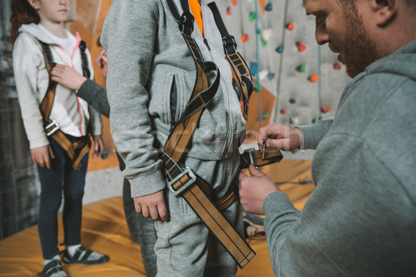 Dad securing son in harness Stock photo © LightFieldStudios
