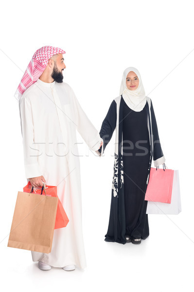 muslim couple with shopping bags Stock photo © LightFieldStudios