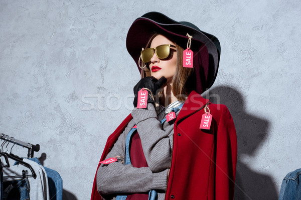 woman in clothes with sale tags Stock photo © LightFieldStudios