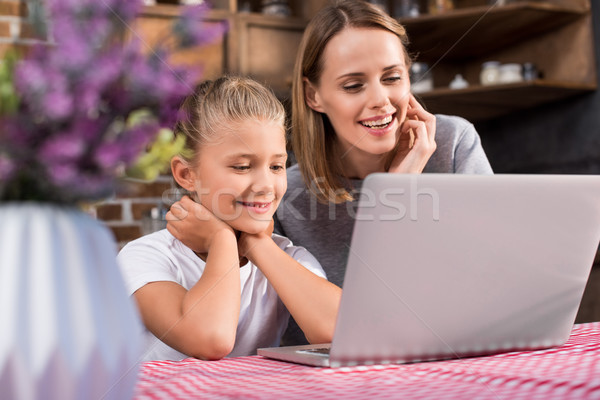 family using laptop Stock photo © LightFieldStudios