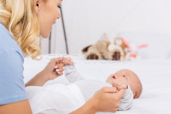 mother holding babys hands Stock photo © LightFieldStudios