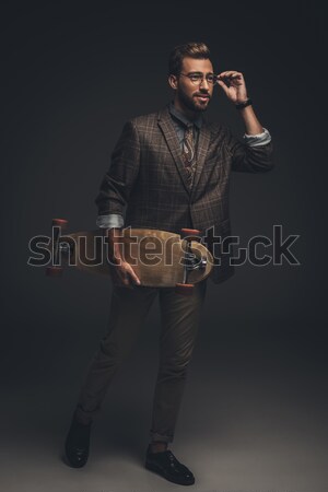 man sitting on stool and pulling suspenders Stock photo © LightFieldStudios
