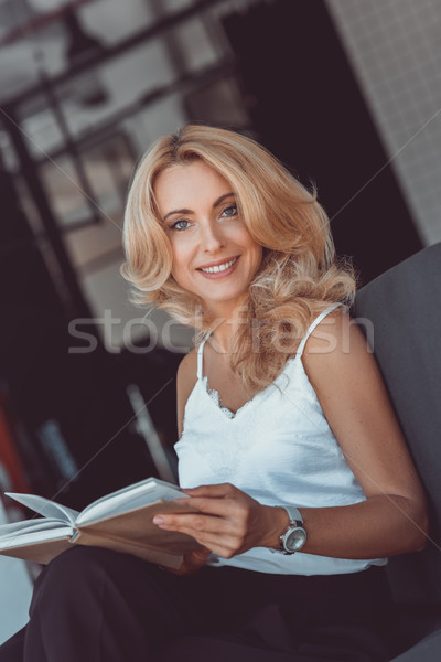 woman reading book  Stock photo © LightFieldStudios