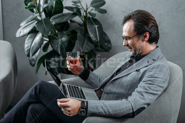 Stock photo: businessman using laptop