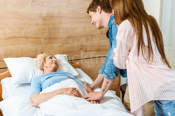 Man visiting sick elderly woman Stock photo © LightFieldStudios