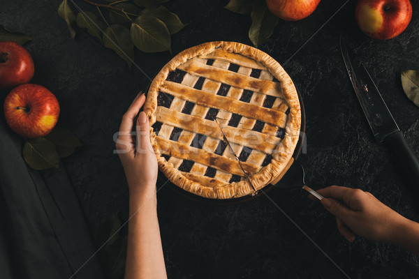 woman taking piece of apple pie Stock photo © LightFieldStudios