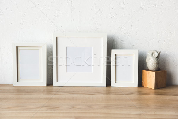 empty photo frames on table Stock photo © LightFieldStudios