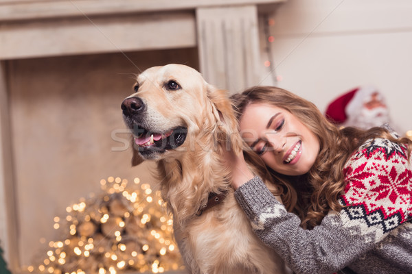 young woman and dog at christmastime Stock photo © LightFieldStudios