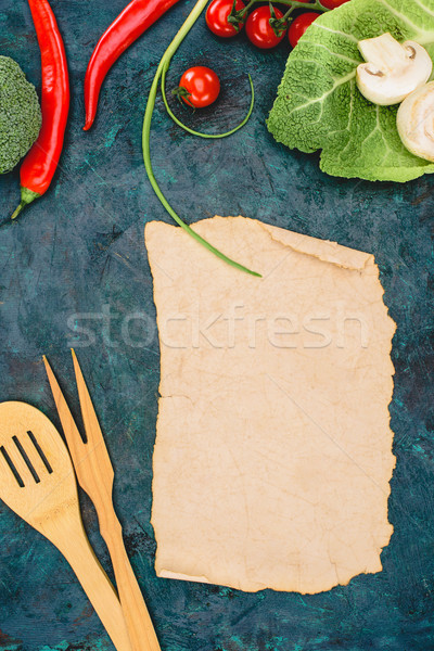 top view of blank parchment, wooden utensils and ripe raw vegetables on black  Stock photo © LightFieldStudios