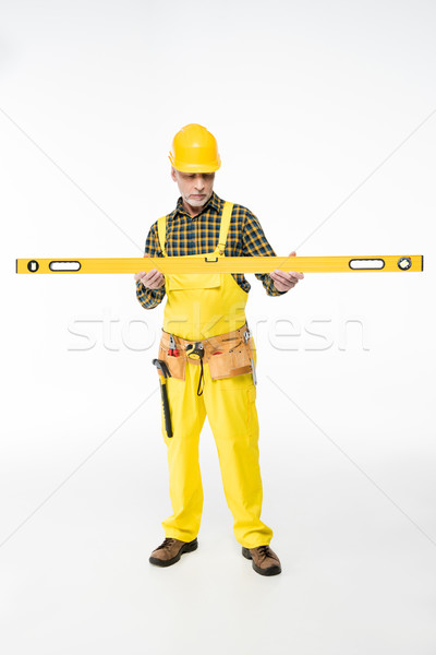 Workman with level tool Stock photo © LightFieldStudios