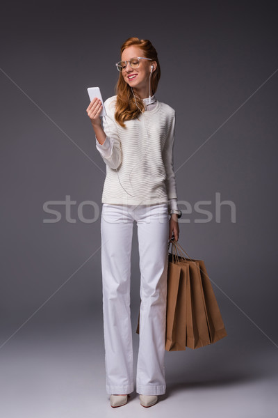 ファッショナブル 少女 スマートフォン ショッピングバッグ 魅力的な 白 ストックフォト © LightFieldStudios