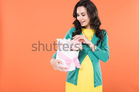 smiling woman with bouquet of flowers Stock photo © LightFieldStudios